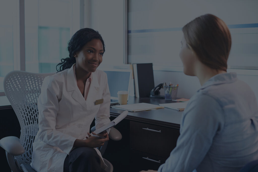 A doctor meeting with a patient in a medical office